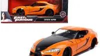 Experience Speed: Toyota Supra in Striking Orange with Black Stripes