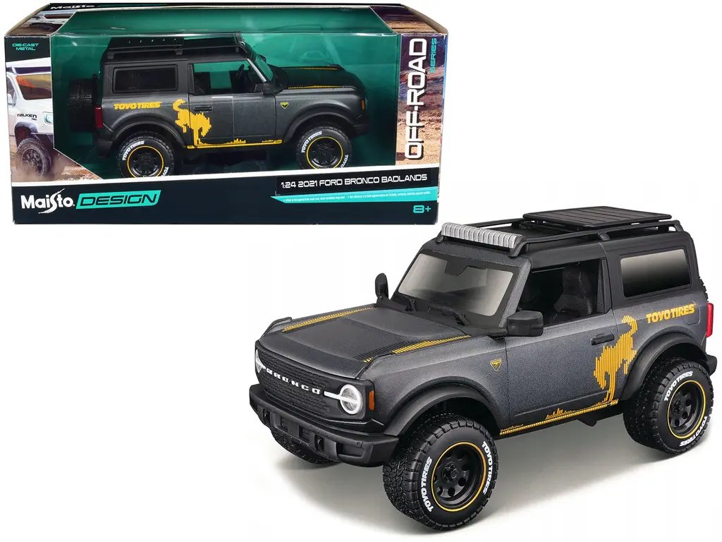 Diecast Model Cars wholesale toys dropshipper drop shipping 2021 Ford Bronco Badlands Dark Gray Metallic with Gold Graphics and Roof Rack Off Road Maisto Design Series 1/24 Maisto 32541GRY drop shipping wholesale drop ship drop shipper dropship drops 2021 Ford Bronco Badlands Dark Gray Metallic 1/24 Diecast Model Car by Maisto Design - Off-Road Edition with Gold Graphics and Roof Rack